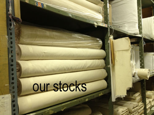 stocks of unbleached muslin on shelves