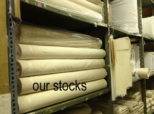 stocks of unbleached muslin on shelves